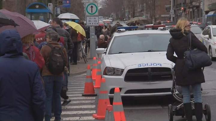 Montreal police block street, as French voters stand in line waiting to cast a ballot in their country’s presidential election. Saturday, April 22, 2017.