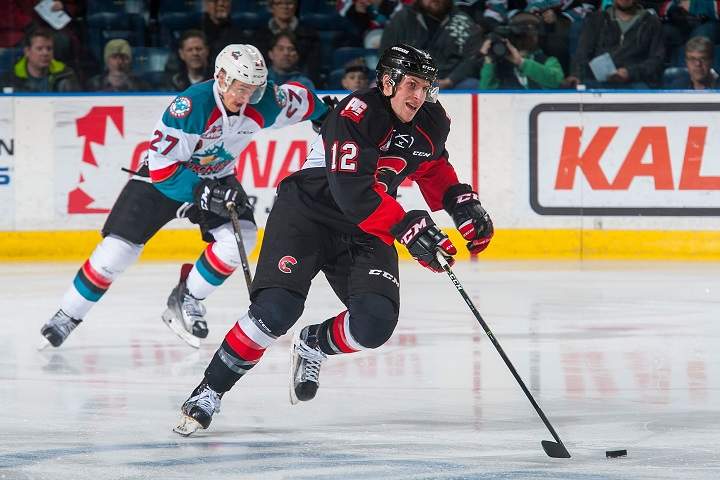 Jansen Harkins skates with the puck during a Prince George Cougars game against the Kelowna Rockets on March 1, 2017 at Prospera Place in Kelowna, BC.