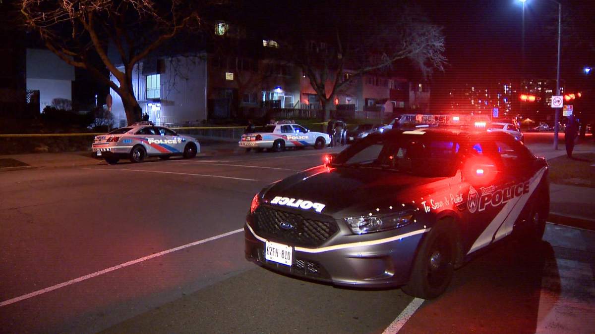 Police investigate on the scene following the shooting on April 13.