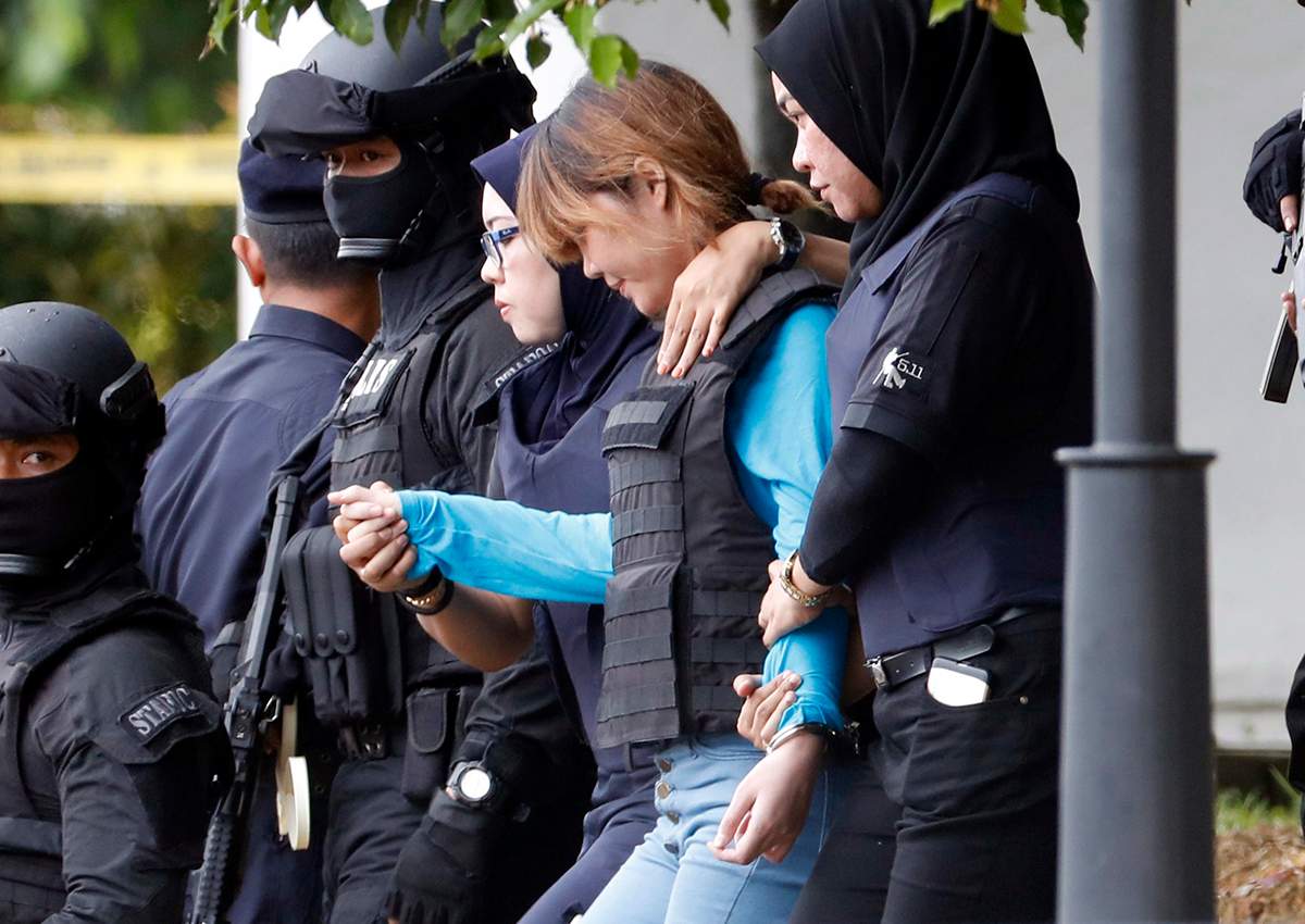 Vietnamese suspect Doan Thi Huong, second right, arrested in the death of Kim Jong Nam, is escorted by police officers as she leaves a court house in Sepang, Malaysia, Thursday, April 13, 2017.