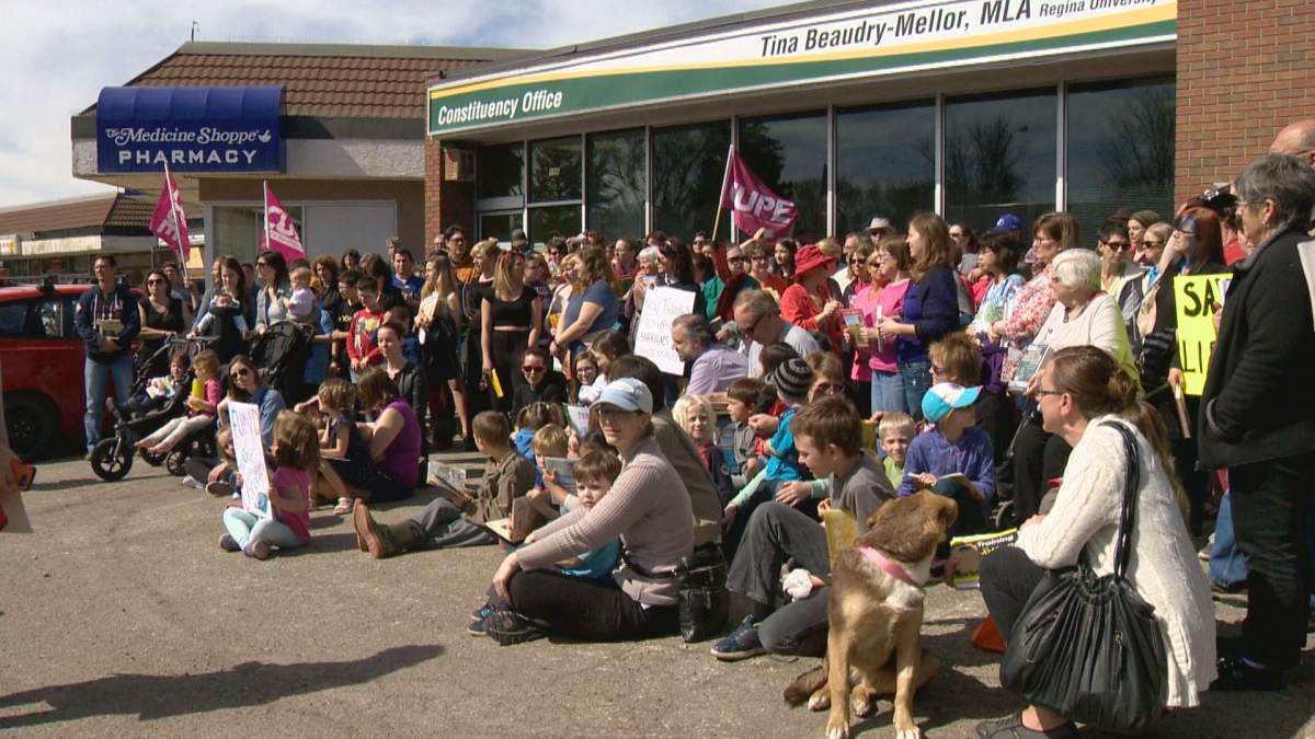 Over one hundred people gathered outside Social Service Minister Tina Beaudry-Mellor's constituency office. 