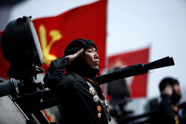 A North Korean soldier salutes from atop an armoured vehicle during a military parade marking the 105th birth anniversary of country’s founding father Kim Il Sung, in Pyongyang April 15, 2017.