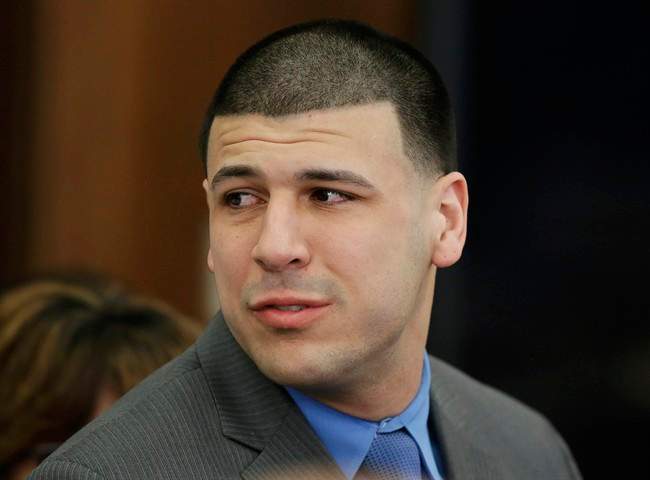 In this Friday, April 14, 2017, file photo, Former New England Patriots tight end Aaron Hernandez turns to look toward his fiancee Shayanna Jenkins Hernandez as he reacts to his double murder acquittal at Suffolk Superior Court in Boston.