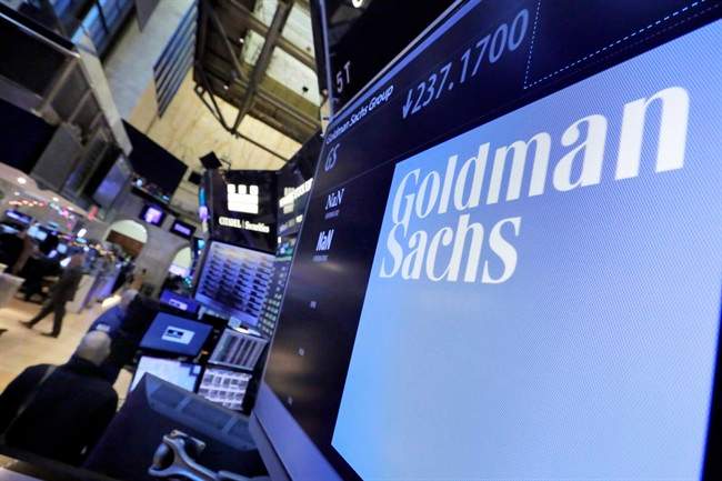 The Goldman Sachs logo appears above a trading post on the floor of the New York Stock Exchange, Dec. 13, 2016.