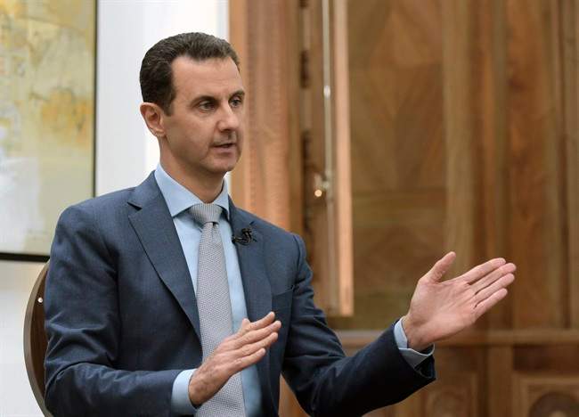 Syrian President Bashar Assad speaks during an interview with Yahoo News in Damascus, Syria. 