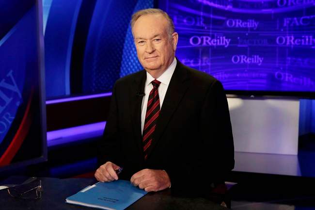In this Oct. 1, 2015 file photo, host Bill O'Reilly of "The O'Reilly Factor" on the Fox News Channel, poses for photos in the set in New York. 