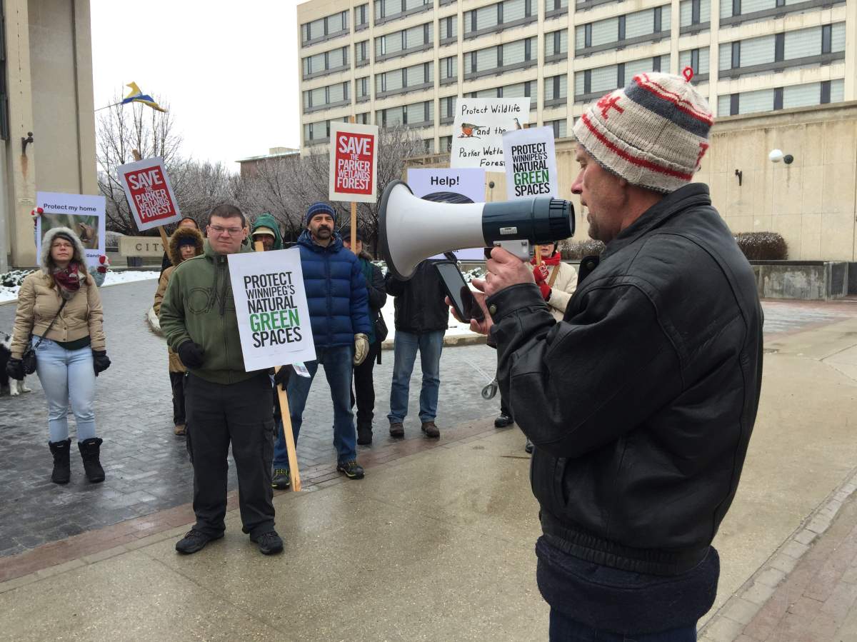 Dozens of people held signs and chanted 'save the Parker Forest' Saturday morning, in hopes of preserving the city green space.