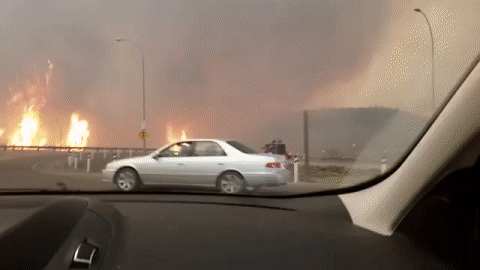 Video taken during the May 3, 2016 evacuation showing traffic turning off the Responders Way bridge onto Highway 63 southbound as flames move closer to downtown Fort McMurray, Alta.
