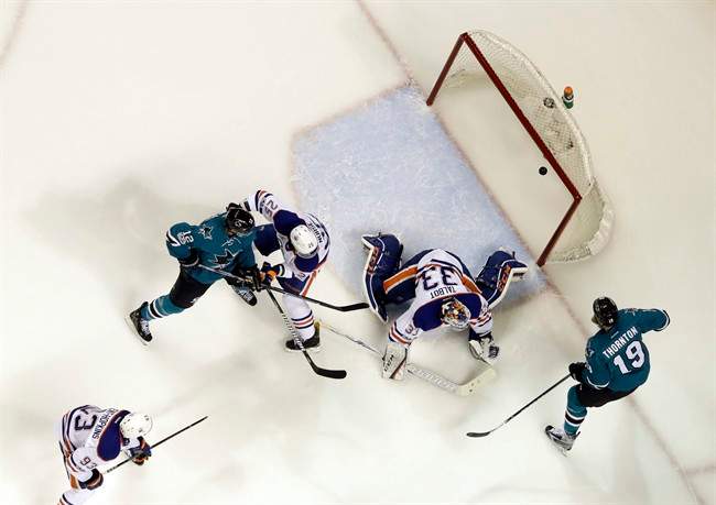Edmonton Oilers goalie Cam Talbot, center, is beaten for a goal on a shot from San Jose Sharks' Logan Couture, not seen, as Joe Thornton (19), Oilers' Darnell Nurse (25) Sharks' Patrick Marleau (12) and Oilers' Ryan Nugent-Hopkins (93) watch during the first period in Game 4 of a first-round NHL hockey playoff series Tuesday, April 18, 2017, in San Jose, Calif. 
