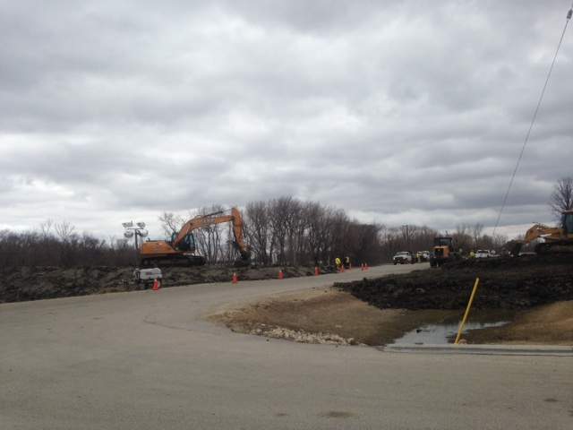 Crews work to secure PR 200 from flooding in St. Adolphe, Manitoba.