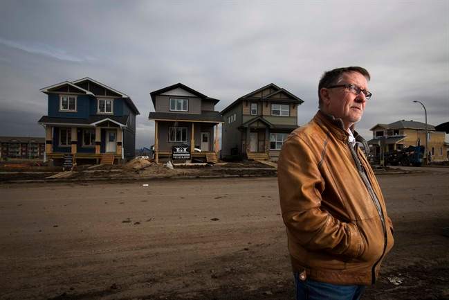 Gilles Huizinga president of the local Urban Development Institute and a homebuilder with Sedgewood Homes with newly built homes in the Timberlea area that was destroyed by wildfires last year in Fort McMurray, Alta. Thursday, April 20, 2017. 