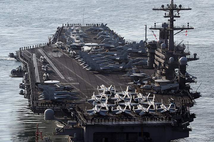 In this March 15, 2017 file photo, U.S. Navy aircraft carrier, the USS Carl Vinson approaches to participate in the annual joint military exercise called Foal Eagle between South Korea and the United States, at Busan port in Busan, South Korea.