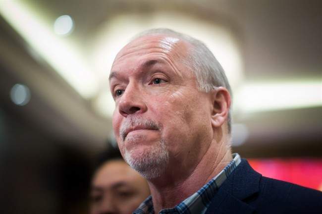 B.C. NDP Leader John Horgan listens to voters during a campaign stop on April 14, 2017.
