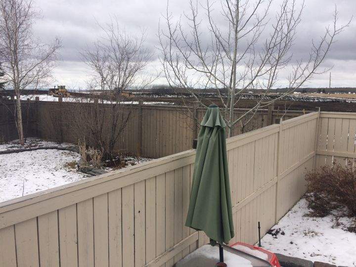 The backyard of a house on Wentworth Drive that backs onto the gravel pit and soon to be ring road.