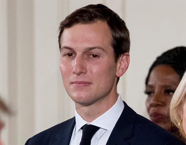 In this Jan. 22, 2017, file photo, President Donald Trump's White House Senior Adviser Jared Kushner watches as President Donald Trump, left, congratulates other White House senior staff during a swearing in ceremony in the East Room of the White House in Washington. 