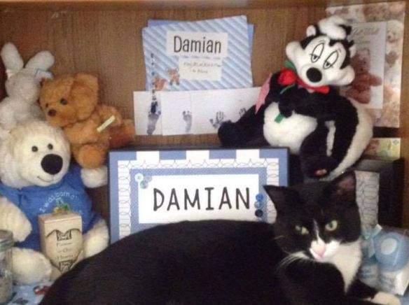 Baby Damian's ashes in the beige urn on the left side of the photo are now back with his mother.