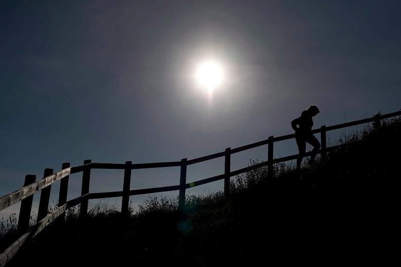 A hiker is silhouetted as they climb the stairs on the Signal Hill hiking trail in St. John’s, in 2014. THE CANADIAN PRESS/Jonathan Hayward