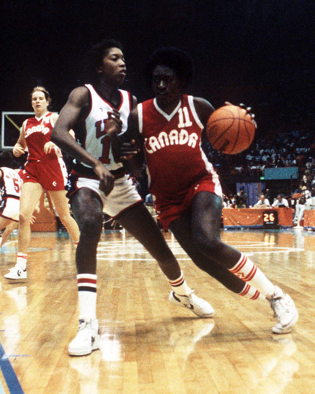 Canada's Sylvia Sweeney (right) runs past a guard during women's basketball action at the 1984 Olympic Games in Los Angeles. 