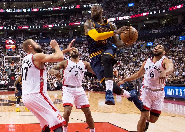 Cleveland Cavaliers forward LeBron James (23) drives to the basket past Toronto Raptors centre Jonas Valanciunas (17) Raptors forward PJ Tucker (2) and Raptors guard Cory Joseph (6) during the first half of game three of an NBA playoff series basketball game in Toronto on Friday, May 5, 2017. 