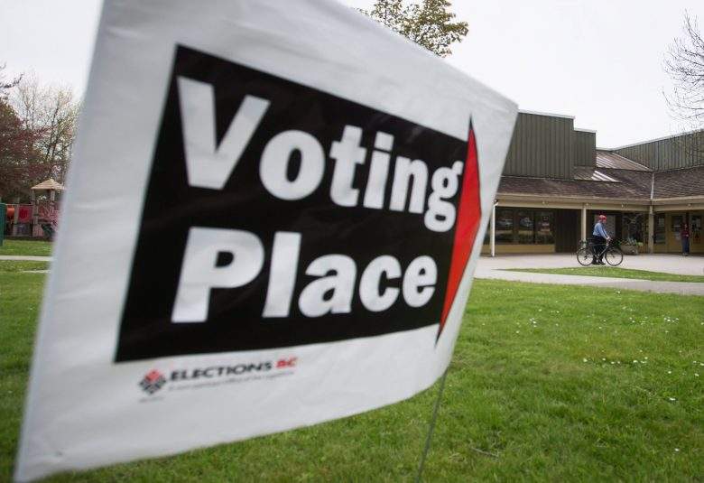 A voter arrives at a polling station on a bike to cast their ballot in the provincial election in the riding of Vancouver-Fraserview, in Vancouver, B.C., on Tuesday May 9, 2017. 