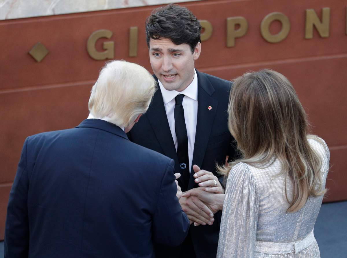 U.S. President Donald Trump and First Lady Melania, talk with Canadian Prime Minister Justin Trudeau as they arrive for a concert in the Ancient Theatre of Taormina ( 3rd century BC) in the Sicilian citadel of Taormina, Italy, Friday, May 26, 2017.