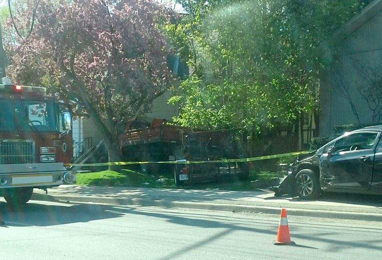 Truck crashes into sedan, then ploughs into house on Oxford Street West - image