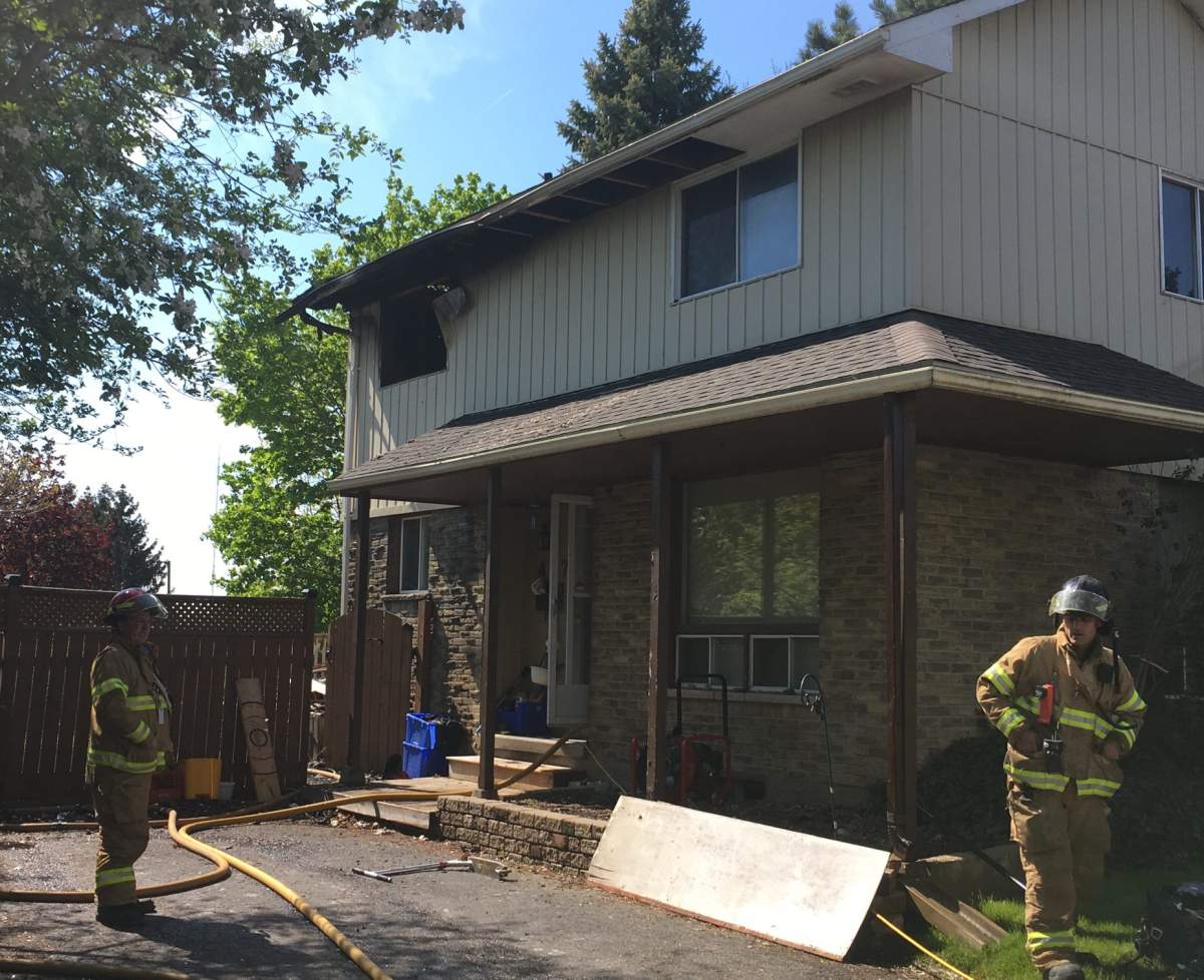 Fire crews at the scene of a house fire in south London that left one dog dead and sent a man to hospital for smoke inhalation on May 16, 2017.