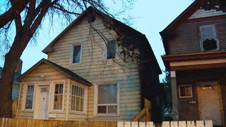 Firefighters worked to extinguish two adjacent houses that caught fire in Saskatoon.