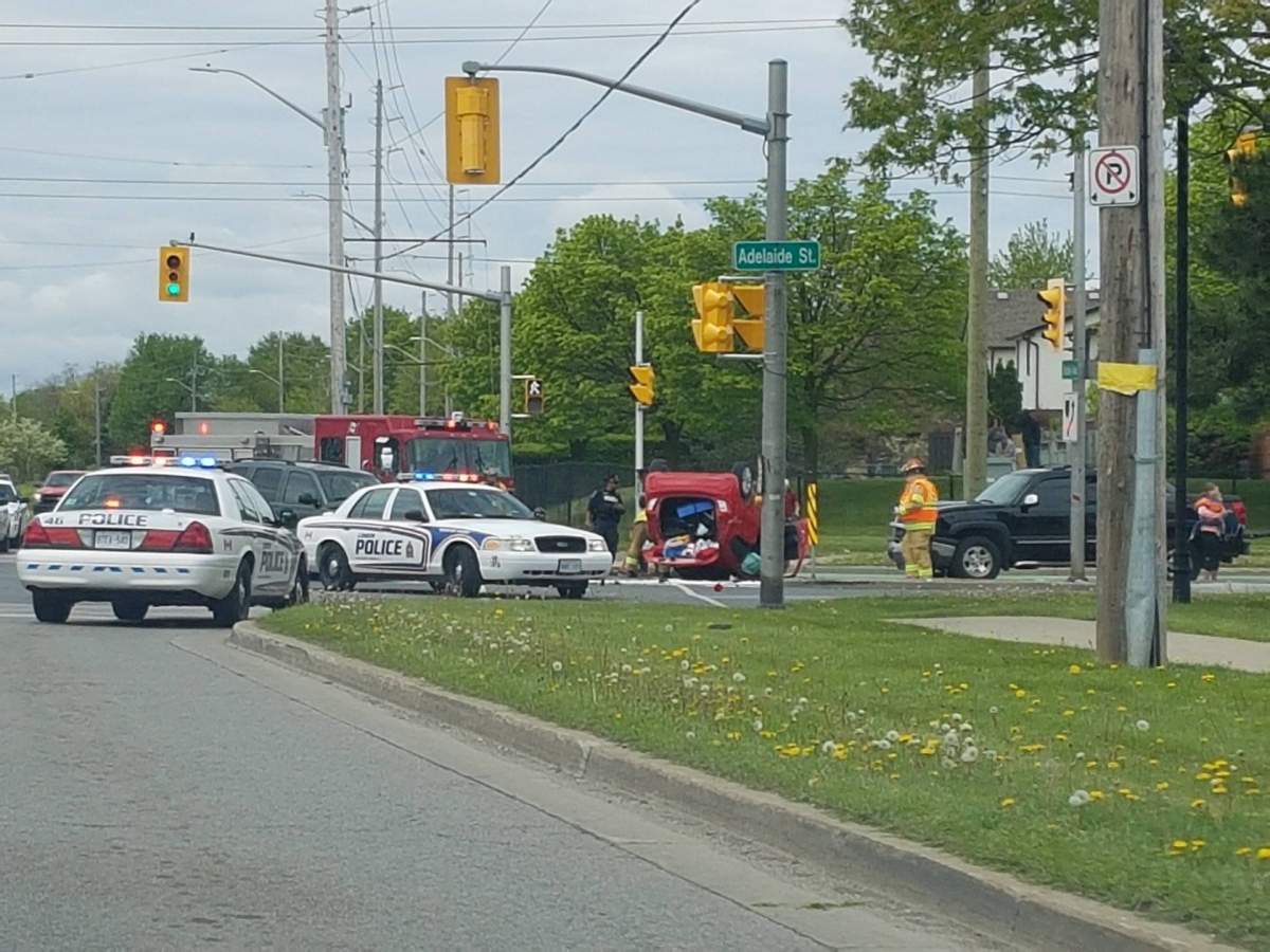 Investigators at the scene of the crash, near Adelaide and Bradley avenues.