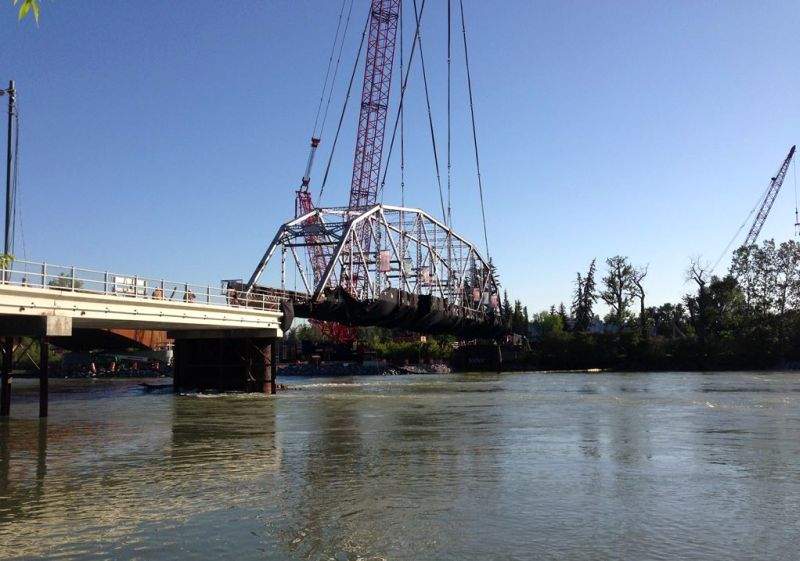 Crews work to remove the Zoo Bridge on 12 Street S.E. on Monday, May 29, 2017. 