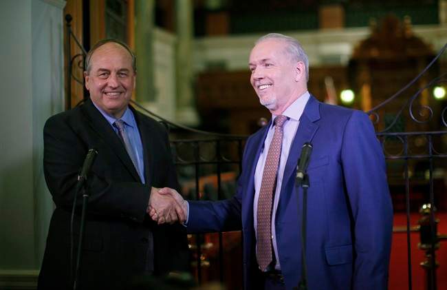 B.C. Green party leader Andrew Weaver and B.C. NDP leader John Horgan speak to media after announcing they'll be working together to help form a minority government during a press conference at Legislature in Victoria, B.C., on Monday, May 29, 2017.