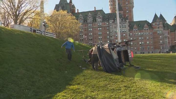 A horse drawn-carriage overturned in Quebec City and tumbled down a grassy hill after the driver lost control of the horse. Saturday, May 20, 2017.