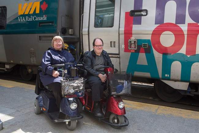 Martin Anderson and Marie Murphy are pictured in front of a Via Rail train at Toronto's Union Station on Saturday May 13, 2017.