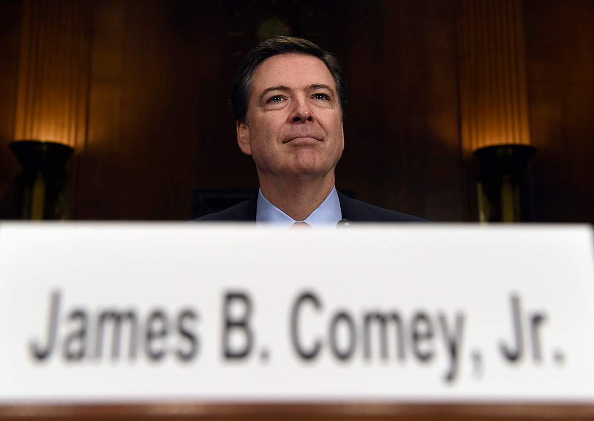In this Dec. 9, 2015 file photo, FBI Director James Comey prepares to testify on Capitol Hill in Washington. 