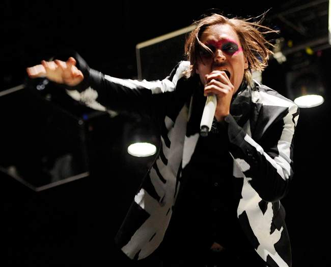 Win Butler of Arcade Fire performs during their headlining set on the third day of the 2014 Coachella Music and Arts Festival in Indio, Calif. in this April 13, 2014 file photo. Arcade Fire's Regine Chassagne and Win Butler are being recognized by Quebec's government for their roles as cultural ambassadors for the province.