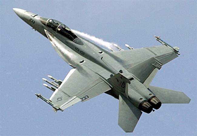 A Boeing F-18 Super Hornet performs during its demonstration flight, on the first day of the 47th Paris Air Show in Le Bourget, north of Paris.