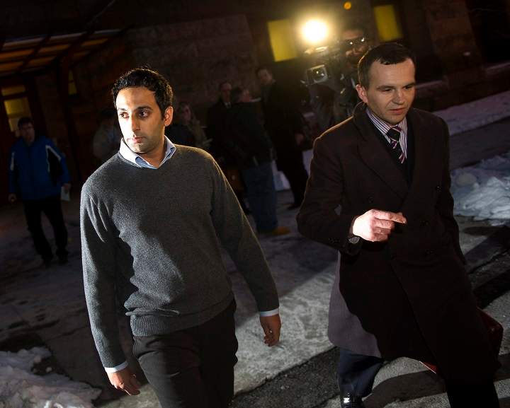 Amitabh Chauhan, 32, left, and his lawyer Sean Robichaud leave the courthouse at Old City Hall in Toronto, Ont. February 23, 2011.