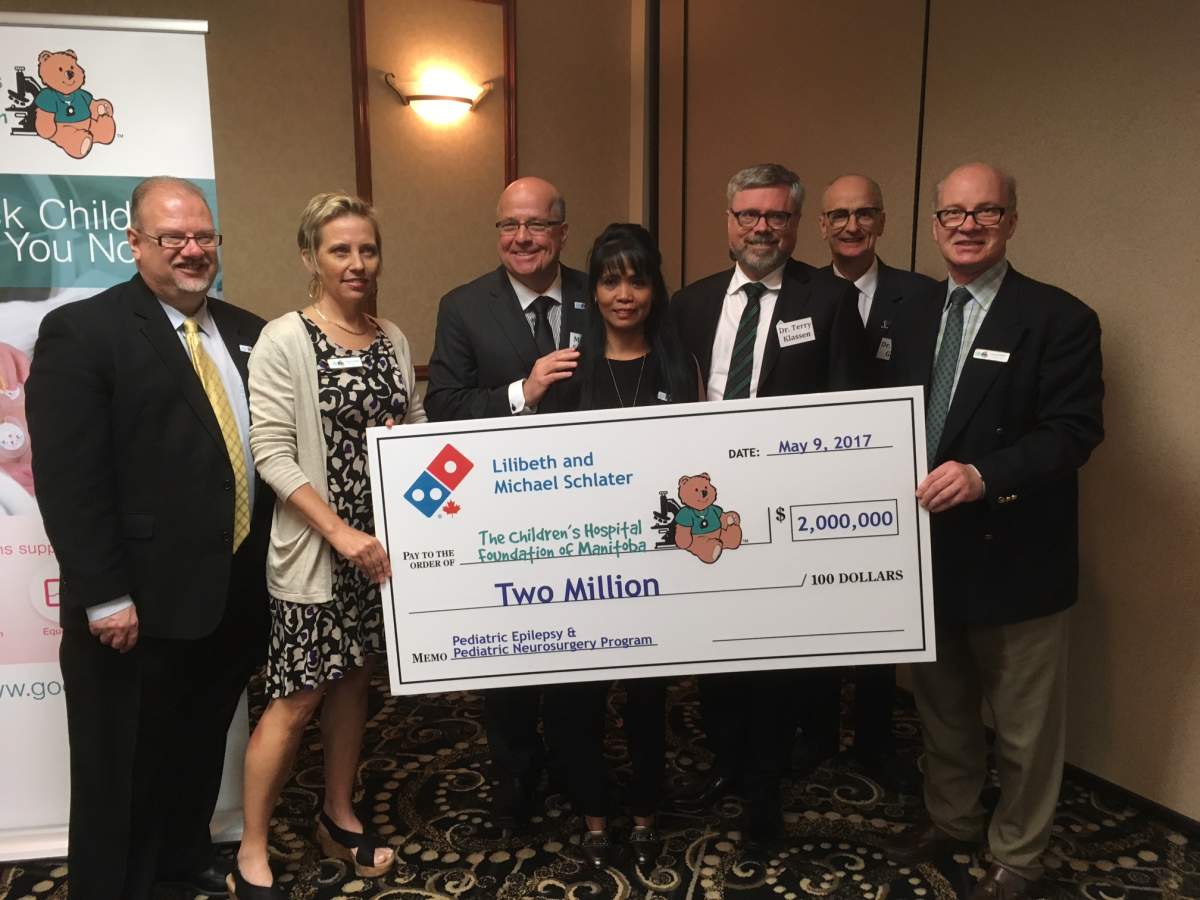 Domino's Pizza of Canada CEO Michael Schlater (third from left) is donating $2 million to Children's Hospital.