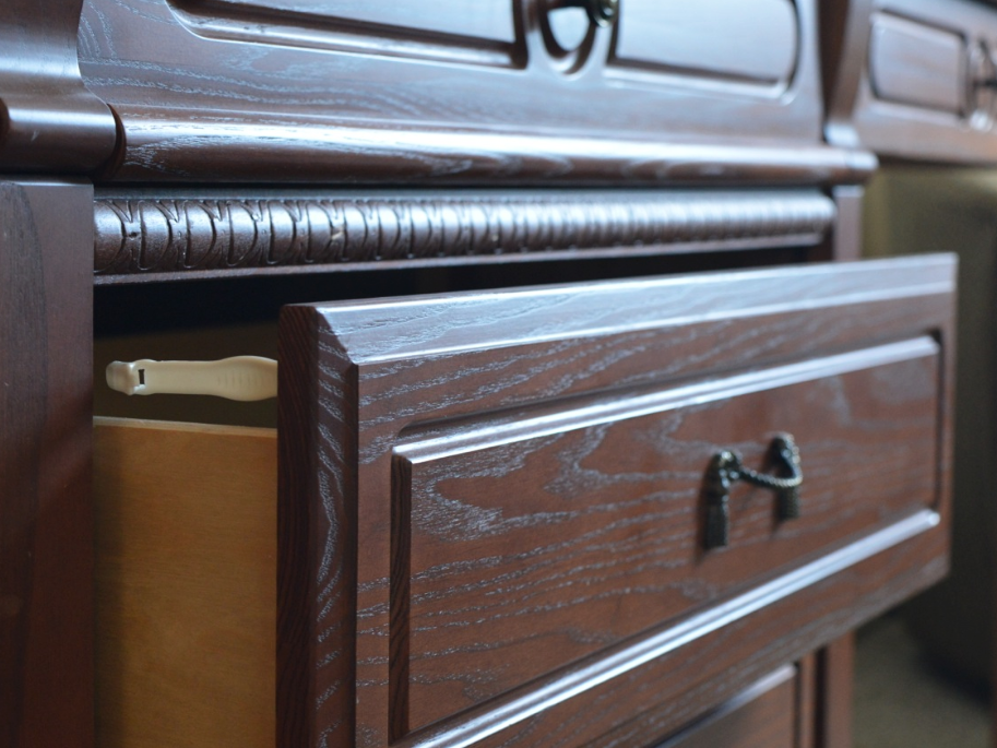 Safety locks on dresser drawers mean parents can keep things out of reach.