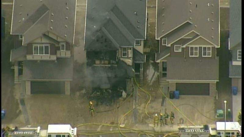 Calgary firefighters battle a blaze along Savanna Grove N.E. on Tuesday, May 23, 2017.