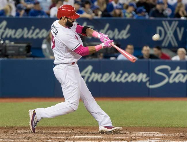 Toronto Blue Jays' Jose Bautista connects on a three-run home run against the Seattle Mariners in the seventh inning of their AL baseball game in Toronto on Saturday, May 13, 2017.