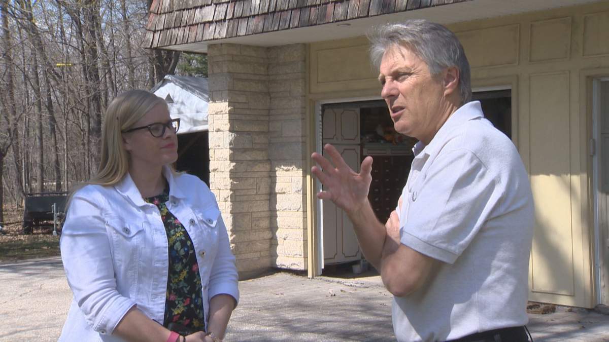 Mike Loewen describes the scene 20 years ago as flood waters threatened his home.