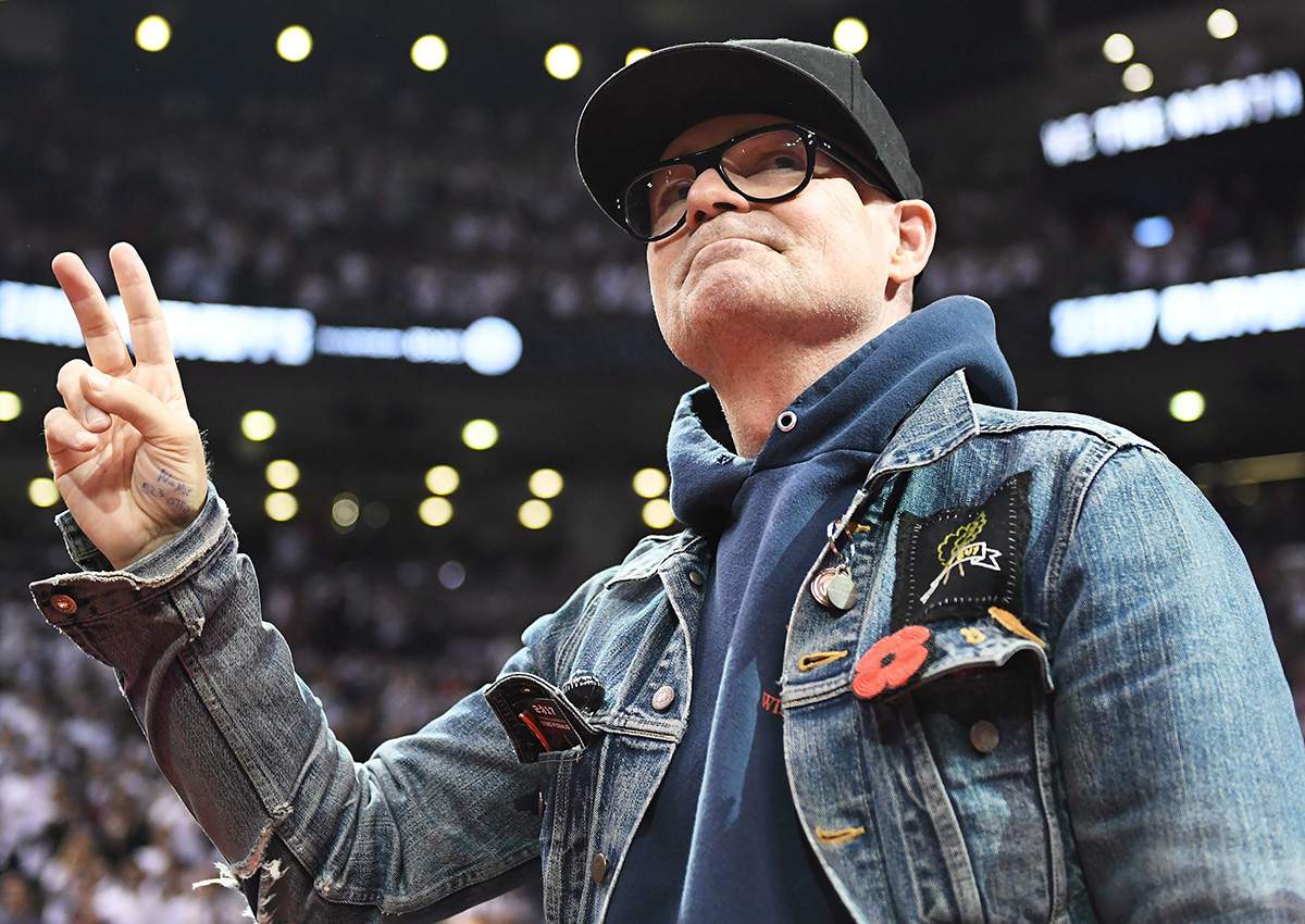 The Tragically Hip lead singer Gord Downie salutes fans during the first half of game three of an NBA playoff series basketball game between the Toronto Raptors and Cleveland Cavaliers in Toronto on Friday, May 5, 2017. 