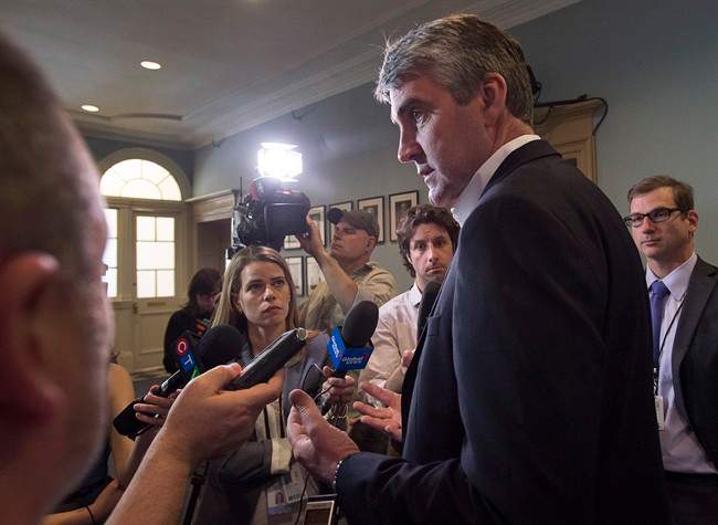 Nova Scotia Premier Stephen McNeil talks with reporters at the legislature in Halifax on Wednesday, May 31, 2017.