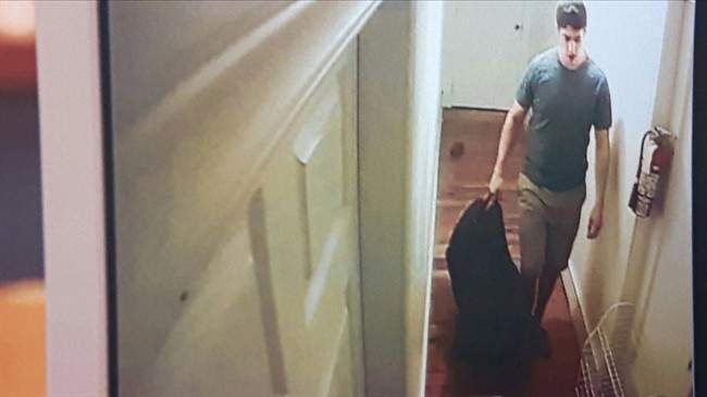 This still photo, shot off surveillance tapes seized from William Sandeson’s apartment, shows the last known moments of Taylor Samson’s life, was released in court, Thursday, May 4, 2017.
