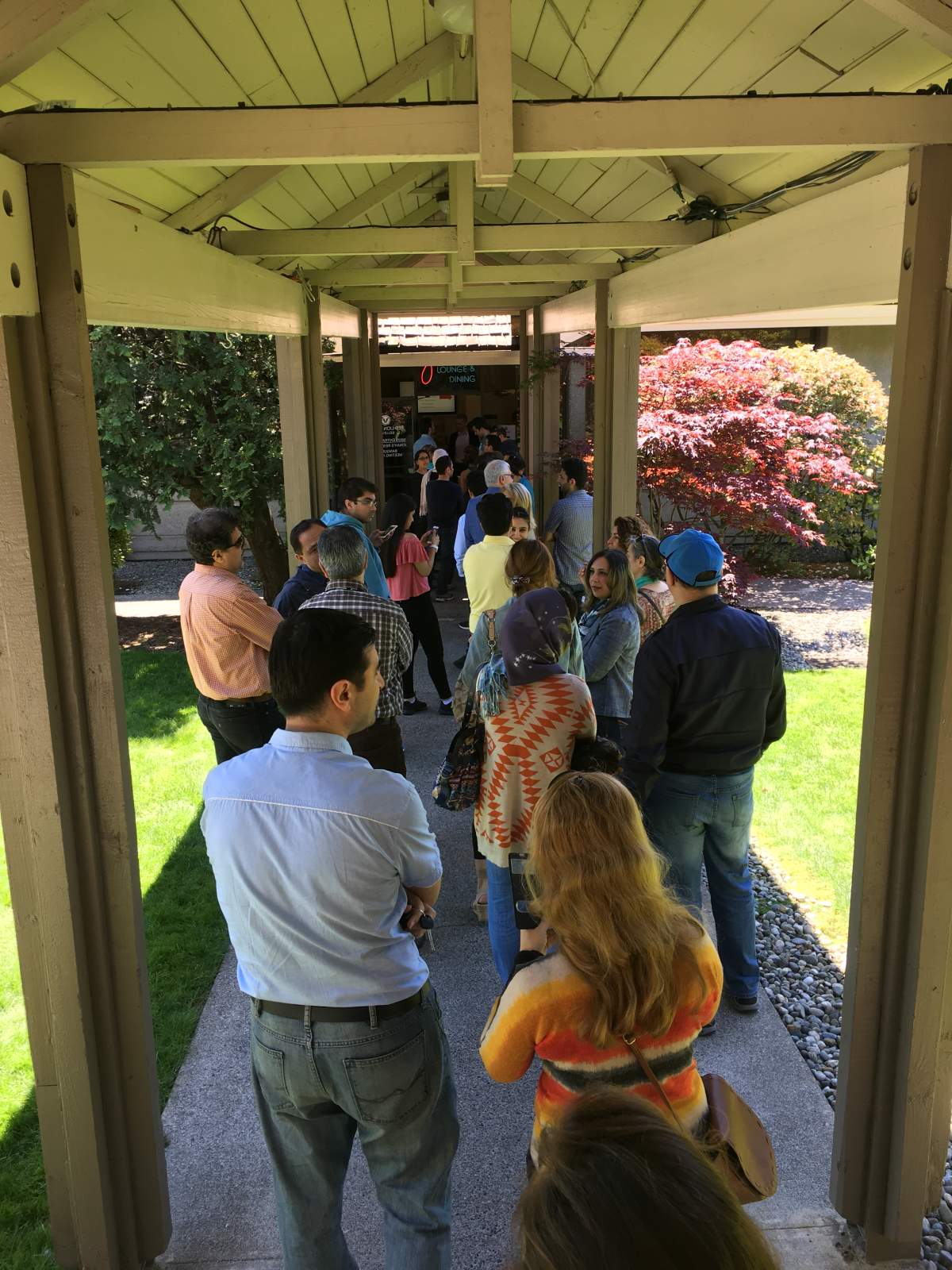 Hundreds of Iranian expats wait for hours to vote in Bellevue, Washington for Iran's presidential election. 
