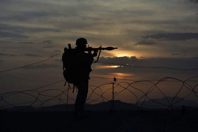 A Pakistani border security guard stands alert at Pakistan-Afghanistan border post, Chaman in Pakistan.