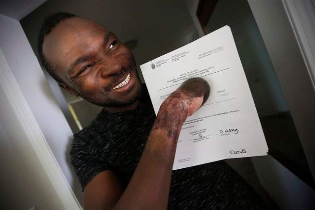 A man who lost all ten of his fingers crossing the border into Manitoba this winter has been granted the right to stay as a refugee.