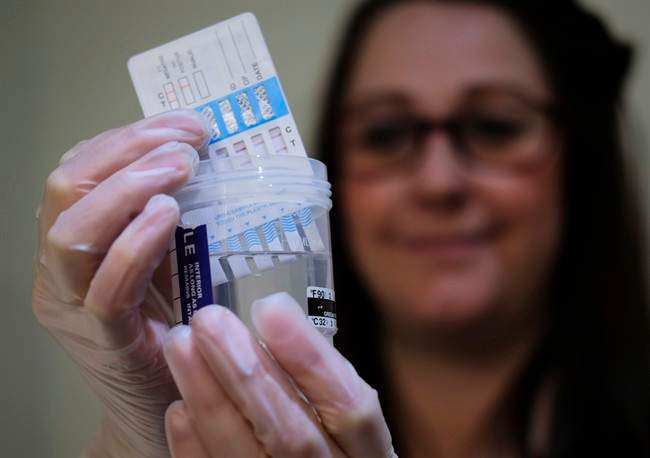 A technician tests a sample at SureHire, an Edmonton-based drug testing company with branches across Canada, in Calgary, Alta., Wednesday, April 26, 2017.