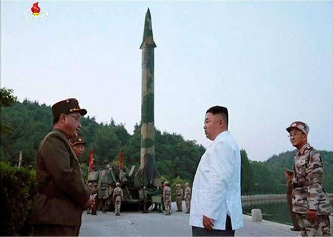 This image made from video of an undated still image broadcasted in a news bulletin on Tuesday, May 30, 2017, by North Korea’s KRT shows North Korean leader Kim Jong Un and a missile launcher in North Korea.